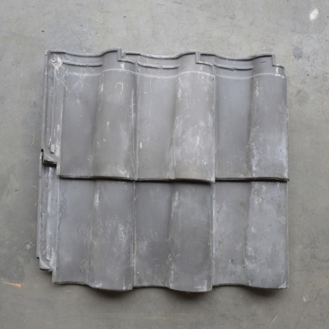 Partij klein Romaanse dakpan blauwgesmoord 